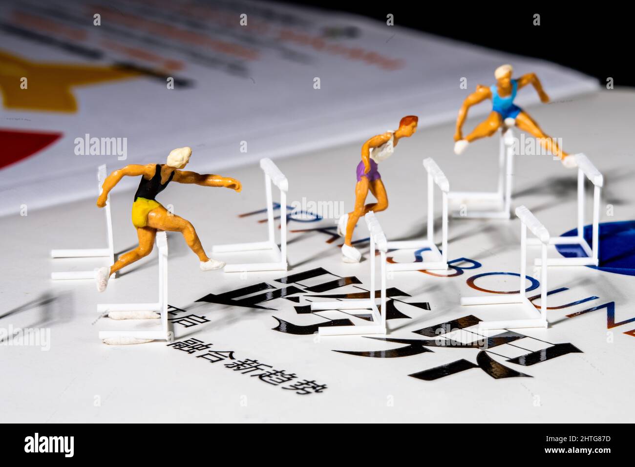 Miniature figurines of athletes during obstacle race Stock Photo Alamy