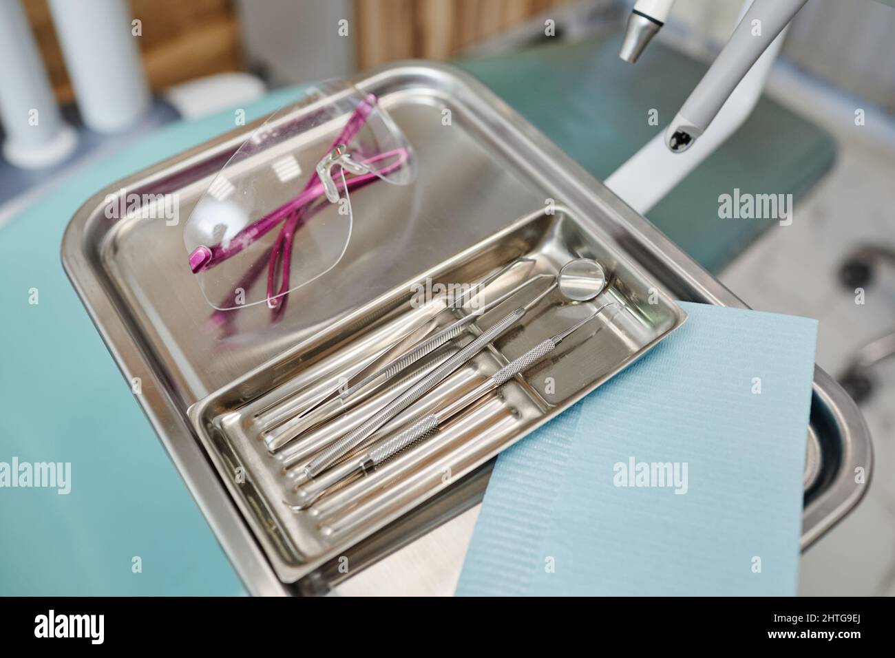 Background image of sterile metal tools on tray in modern dental clinic