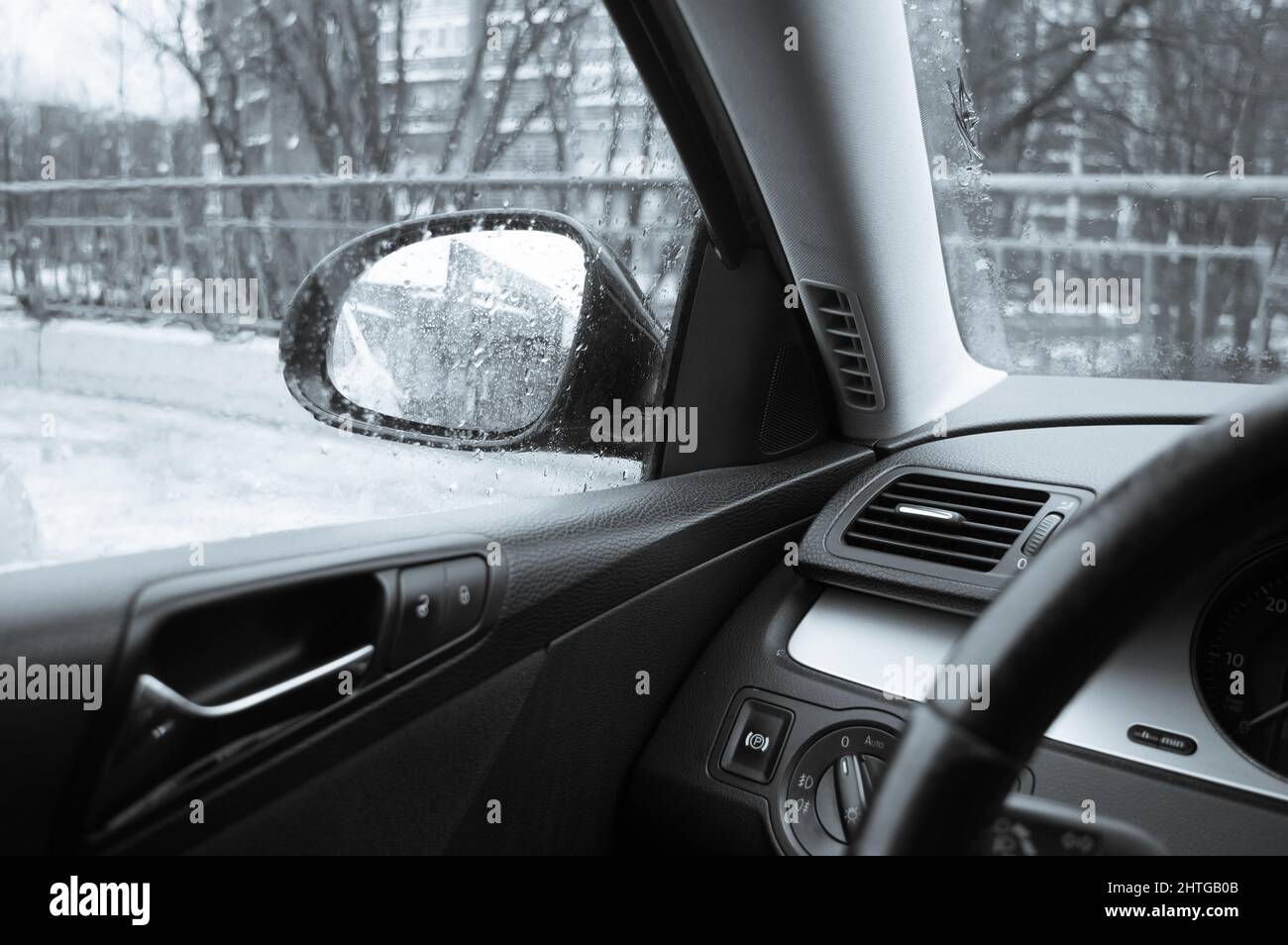 View through car window in rainy weather. Rear view window Stock Photo Alamy