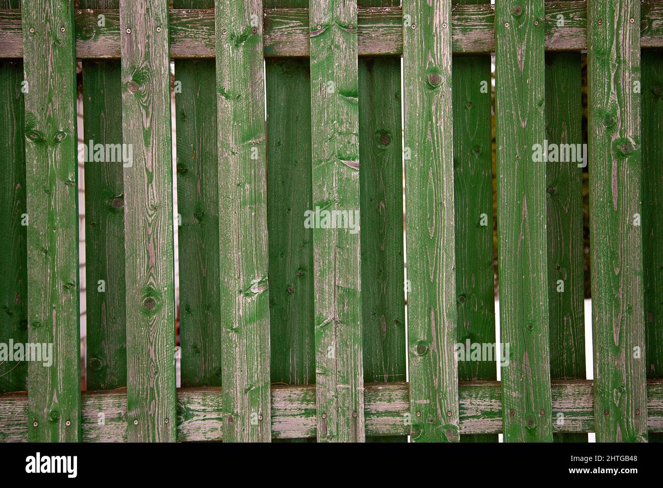 old wooden green fence with peeling paint Stock Photo - Alamy