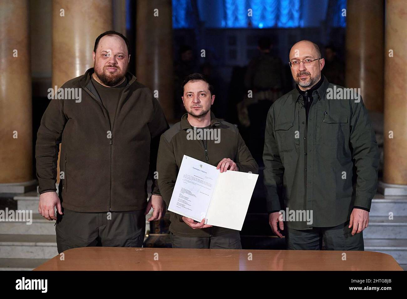 Kyiv, Ukraine. 28th Feb, 2022. Ukrainian President Volodymyr Zelenskiy (C) with Prime Minister Denys Shmygal (R) and Parliament Speaker Ruslan Stefanchuk after they signed an official request for Ukraine to join the European Union, in Kyiv, Ukraine, on Monday February 28, 2022. Photo by Ukrainian President's Office/UPI Credit: UPI/Alamy Live News Stock Photo