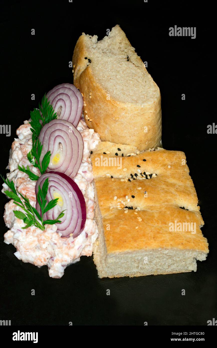 Salmon tartare with red onions and flatbread Stock Photo