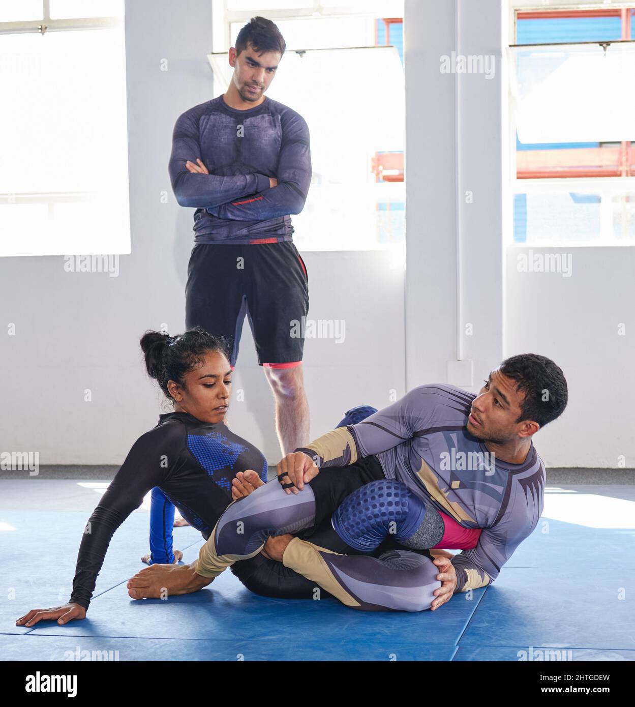 Leading by example. Full length shot of a jiu jitsu sensei sparring