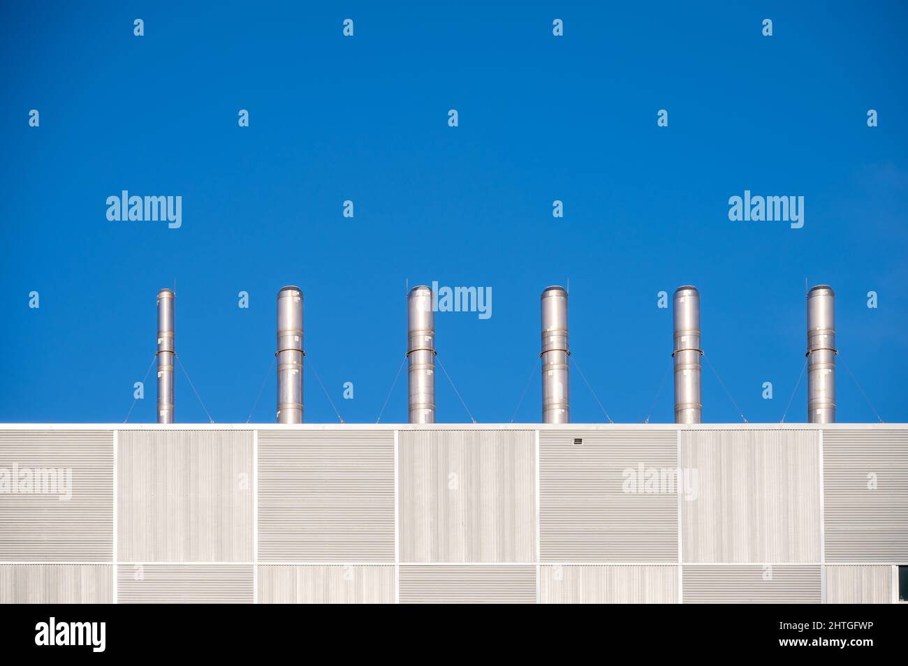 Exhaust pipes on the roof of a modern building Stock Photo Alamy