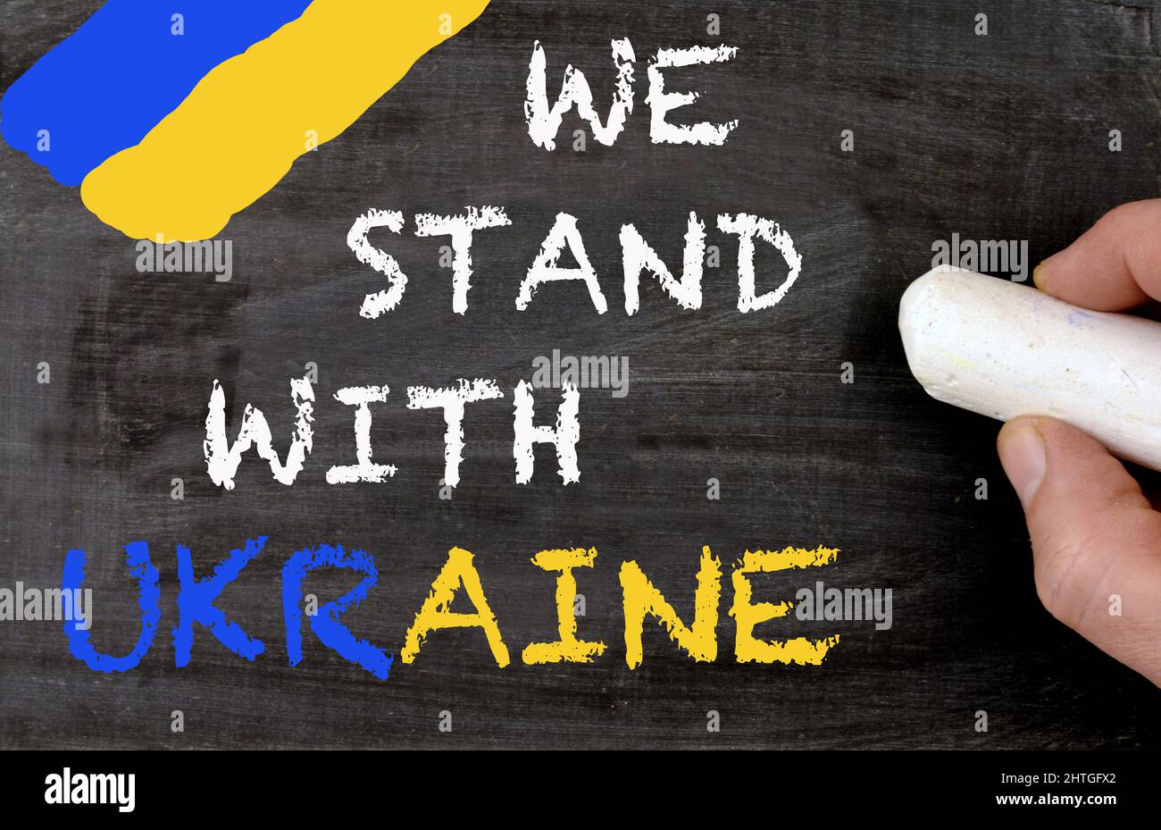 We stand with Ukraine blackboard and ukrainian colors Stock Photo
