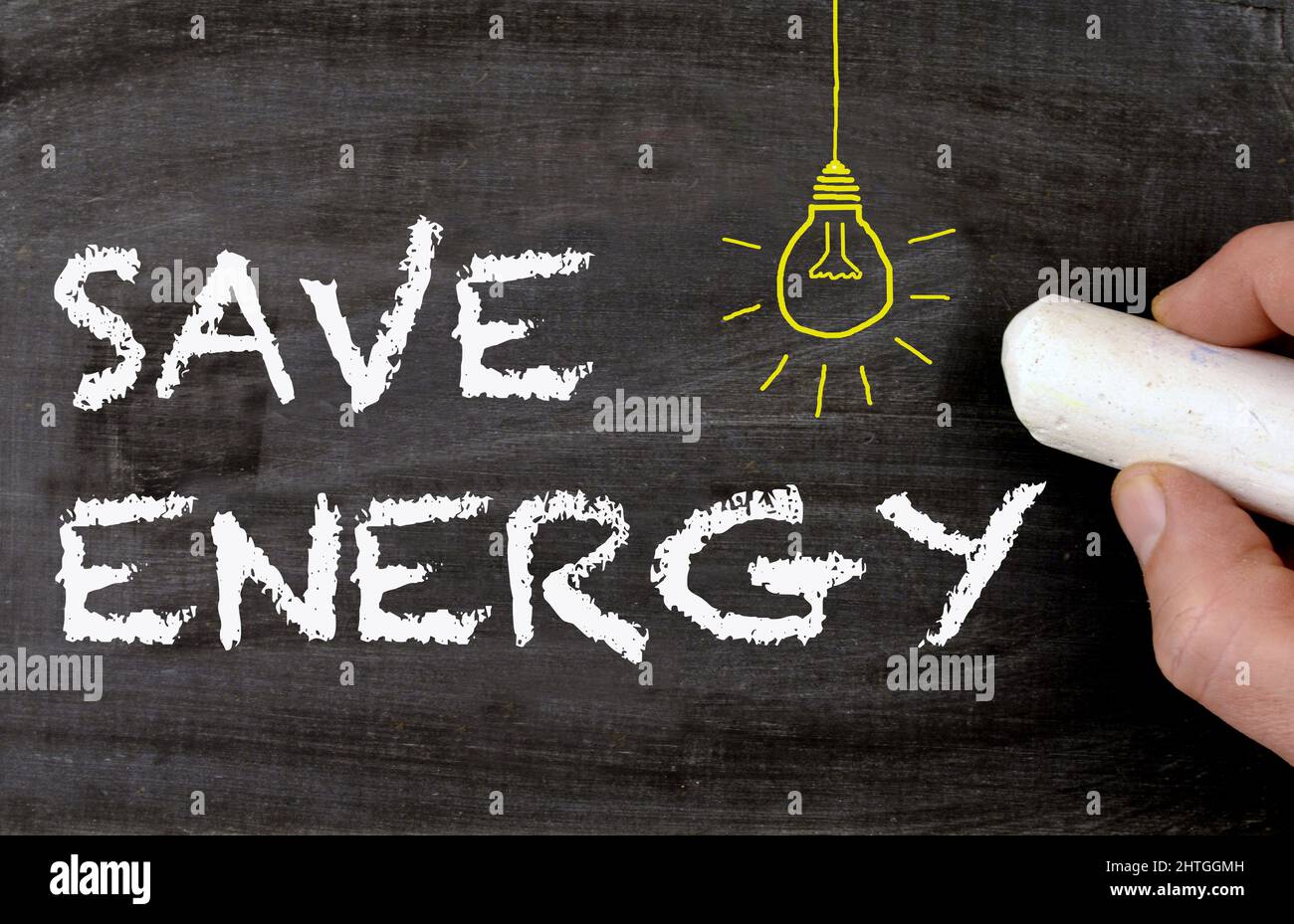 Save Energy - chalkboard with lamp drawing Stock Photo
