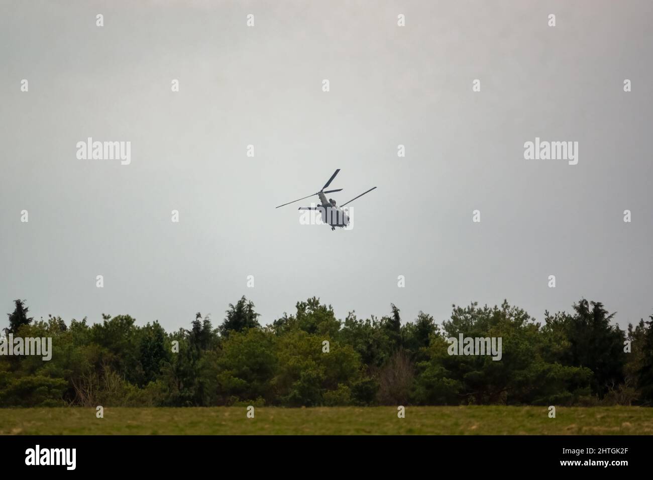 RAF Chinook tandemrotor CH47 helicopter flying fast and low in a