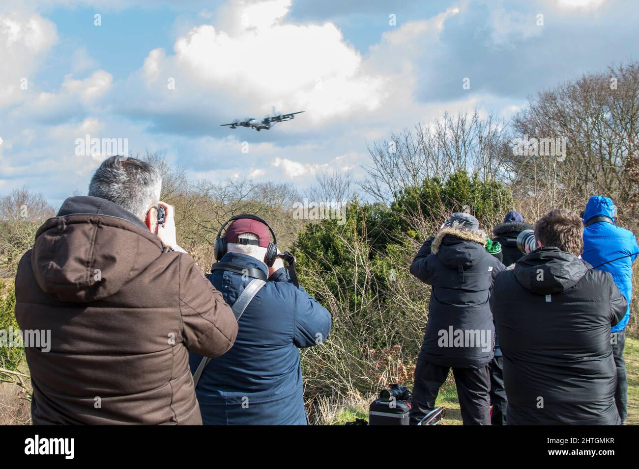 Plane spotters at Mildehall Air Field taking pictures of  Lockheed C130 Hercules Stock Photo