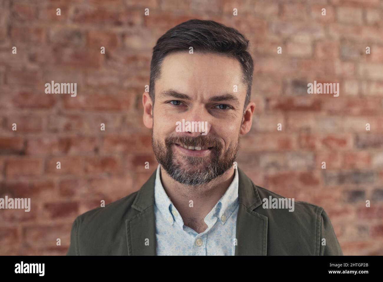 handsome caucasian smiling businessman running his own brand. High quality photo Stock Photo
