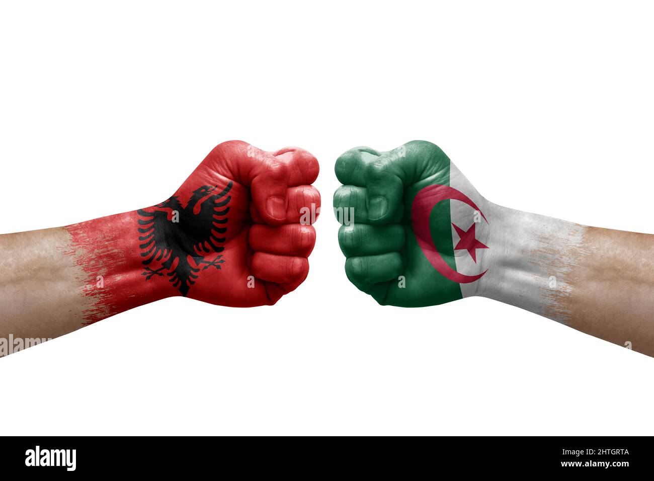 Two hands punch to each others on white background. Country flags painted fists, conflict crisis concept between albania and algeria Stock Photo