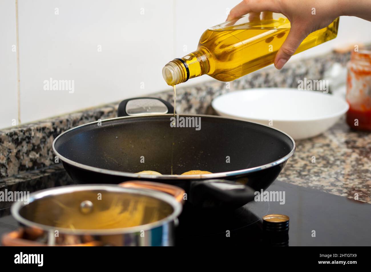 Oil pouring into a pan hires stock photography and images Alamy