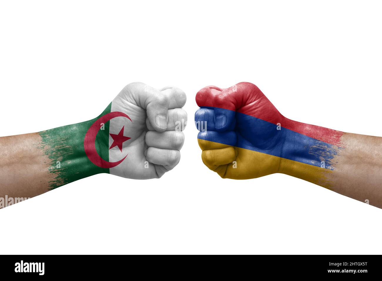 Two hands punch to each others on white background. Country flags painted fists, conflict crisis concept between algeria and armenia Stock Photo