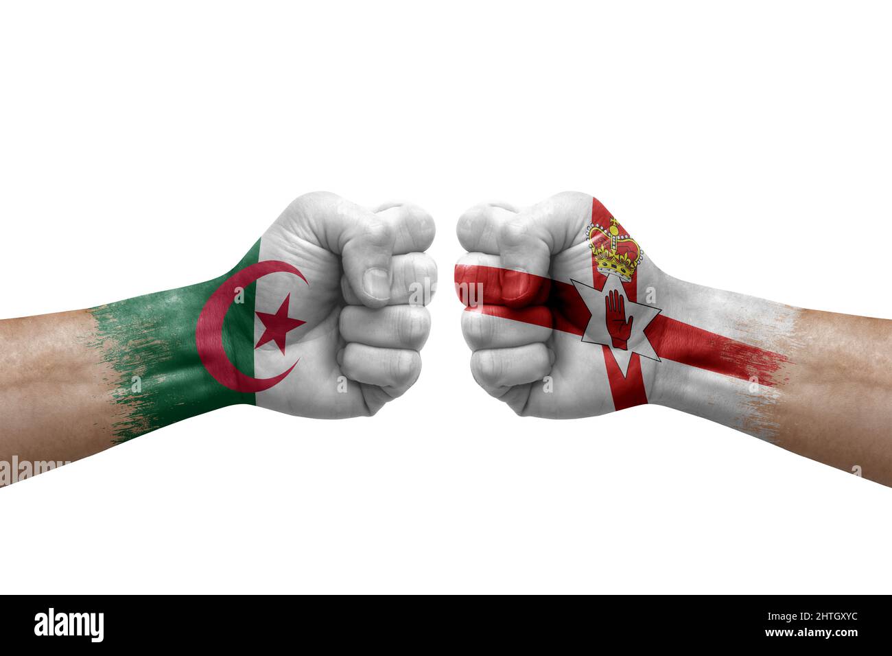 Two hands punch to each others on white background. Country flags painted fists, conflict crisis concept between algeria and ireland Stock Photo