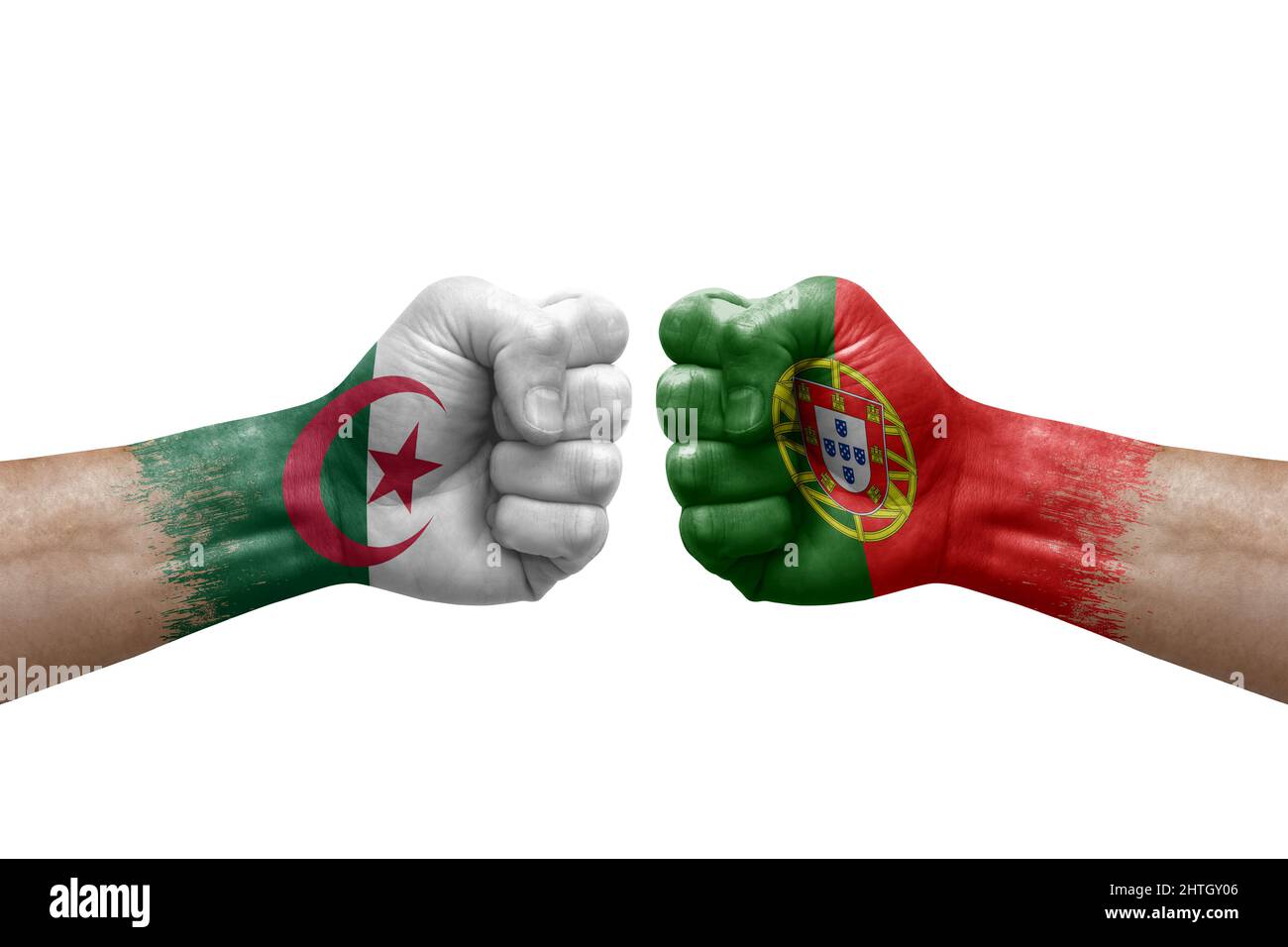 Two hands punch to each others on white background. Country flags painted fists, conflict crisis concept between algeria and portugal Stock Photo