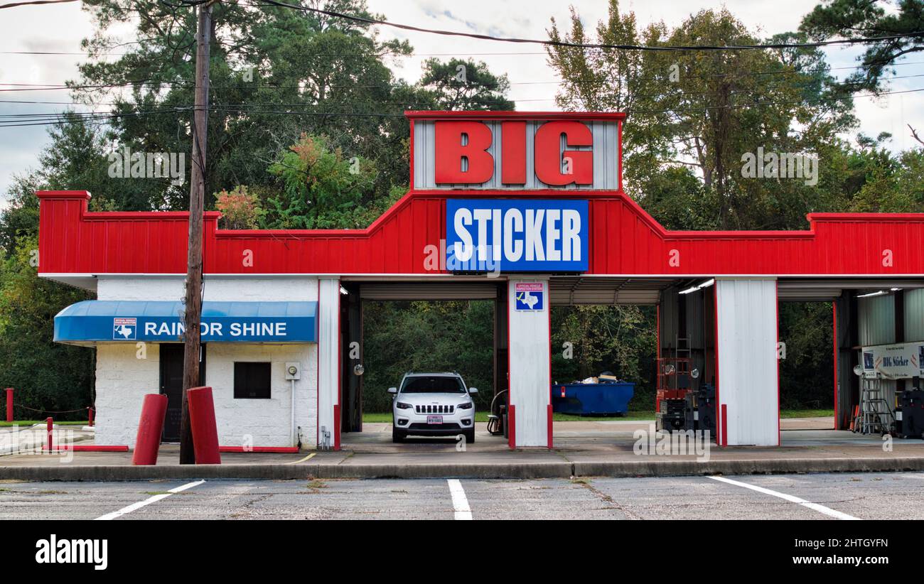 Houston, Texas USA 12-24-2021: Big Sticker front street side exterior view in Houston, TX. Smog check inspection station, family owned business. Stock Photo
