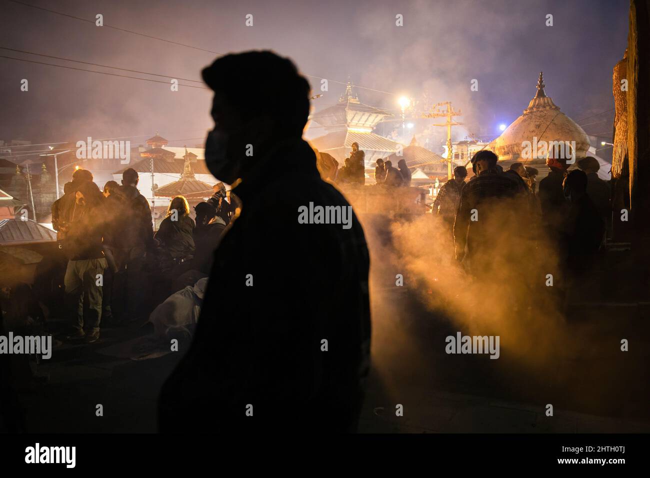 Kathmandu, Nepal. 28th Feb, 2022. Hindu devotees gather to observe the religious rituals and dance on the eve of the Maha Shivaratri festival at the premises of Pashupatinath Temple. Credit: SOPA Images Limited/Alamy Live News Stock Photo