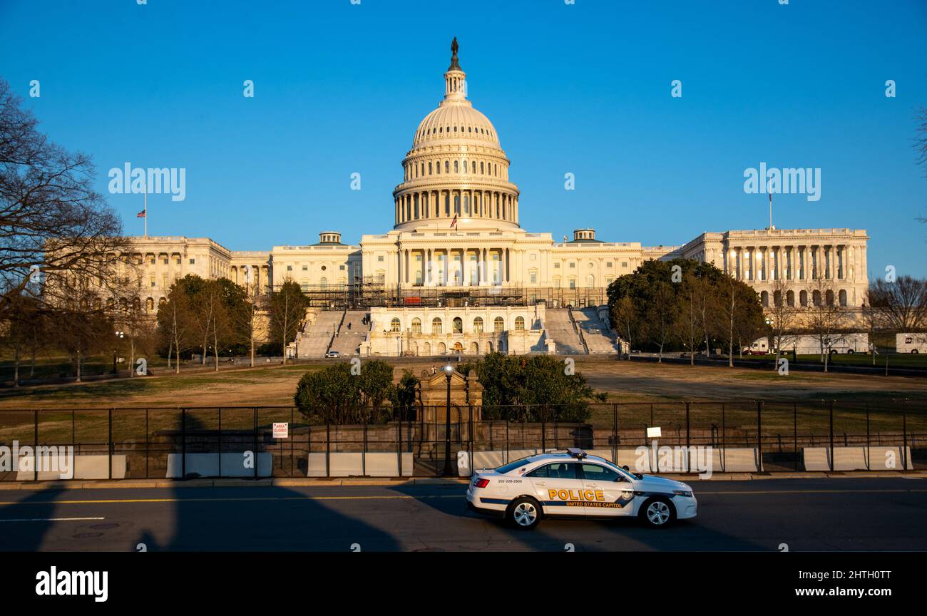 Washington, USA. 28th Feb, 2022. A Capitol Police vehicle drives past security fencing reinstalled at the U.S. Capitol ahead of President Biden's State of the Union address in Washington, D.C on February 28, 2022. (Photo by Matthew Rodier/Sipa USA) Credit: Sipa USA/Alamy Live News Stock Photo
