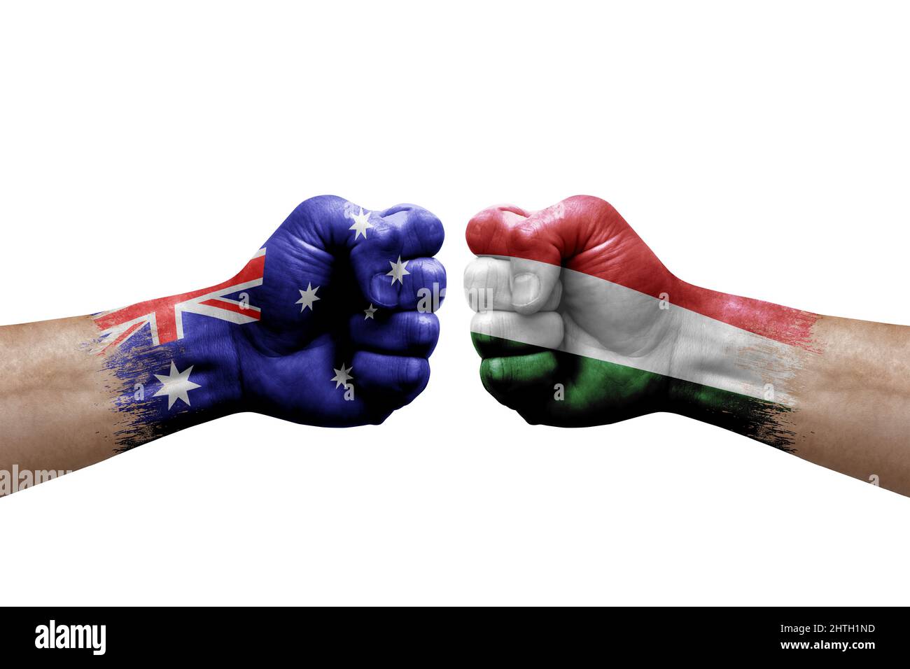 Two hands punch to each others on white background. Country flags painted fists, conflict crisis concept between australia and hungary Stock Photo