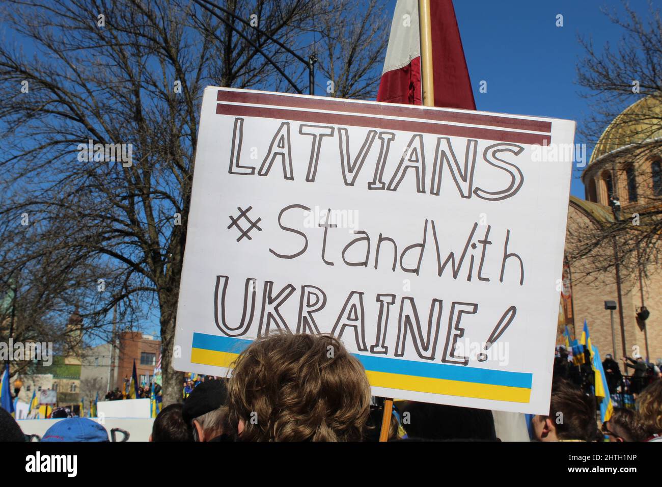 Latvians stand with Ukraine protest sign at Ukrainian Village protest in Chicago Stock Photo