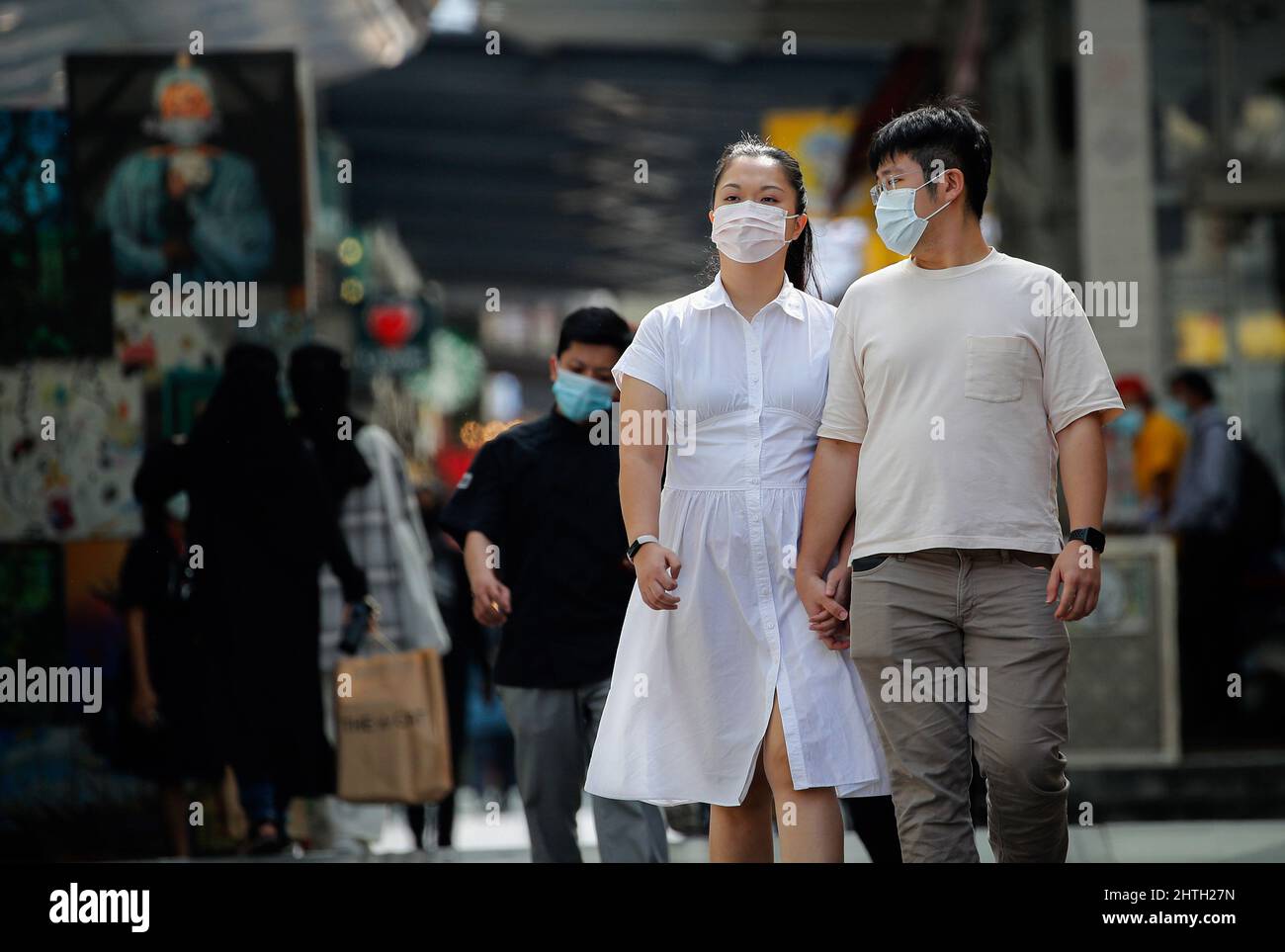 Kuala Lumpur, Malaysia. 28th Feb, 2022. Pedestrians wearing face masks