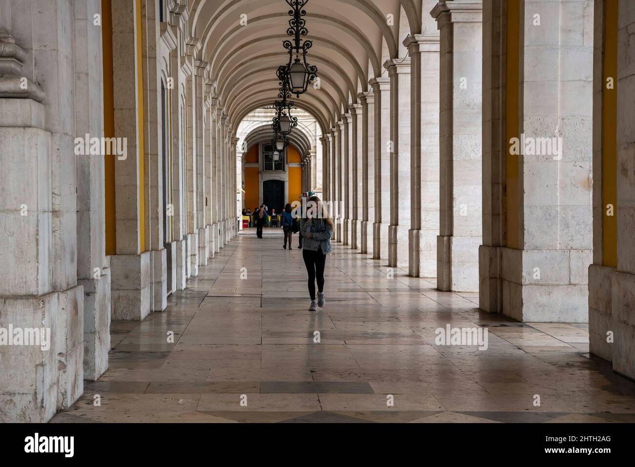 Lisbon, Portugal. 17th Feb, 2022. A person is seen walking through the galleries around the historic area of Praça de Comercio. According to the General Health Direction (DGS), Portugal has recorded a total of 2,795,830 cases of COVID-19 since the beginning of the pandemic. At least 20,077 patients have died, while 155 still remain in intensive care units. (Credit Image: © Jorge Castellanos/SOPA Images via ZUMA Press Wire) Stock Photo