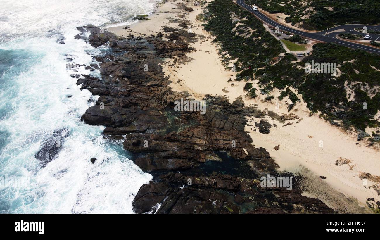 Aerial view of splashing waves on a rocky coast Stock Photo - Alamy