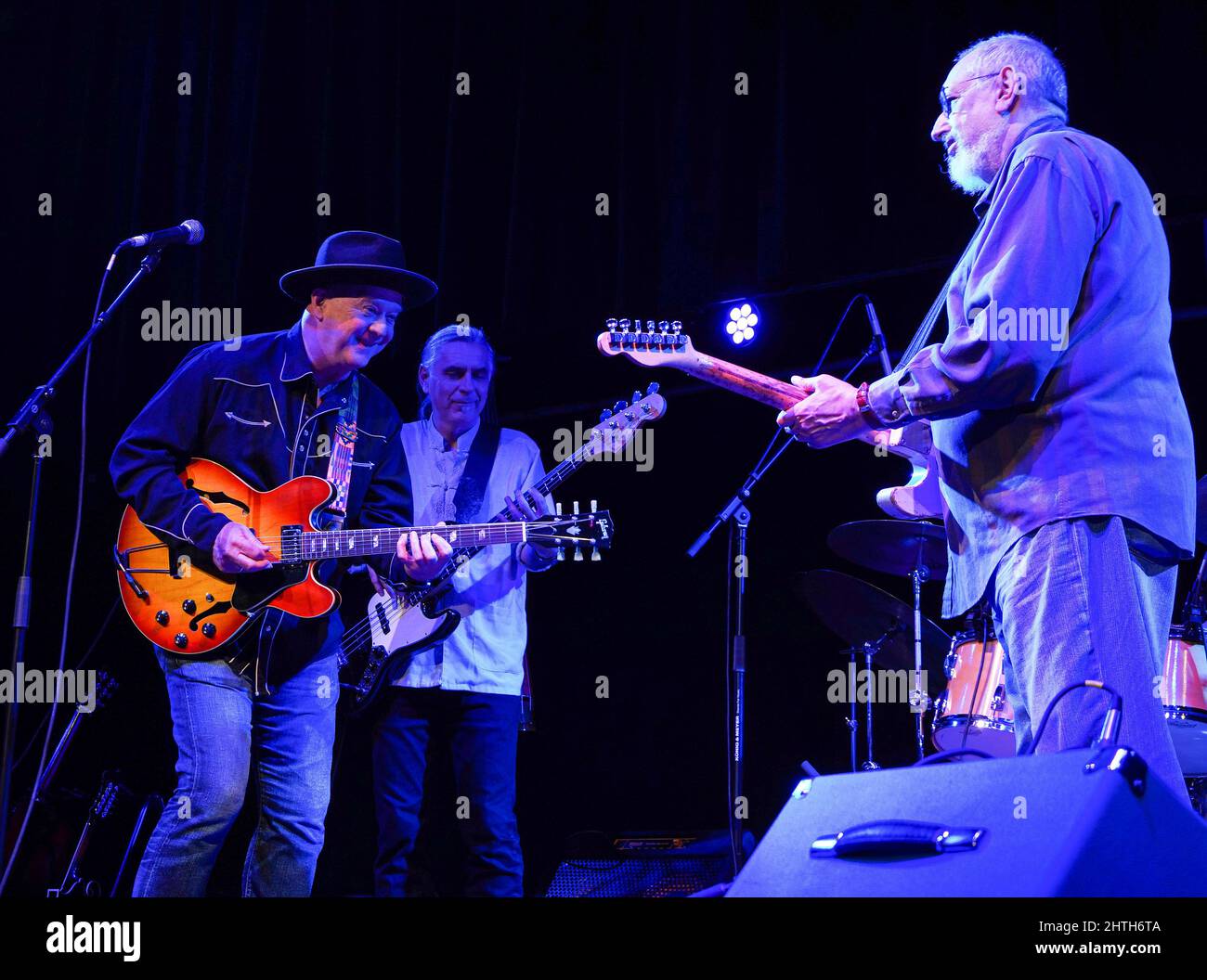 Melbourne, United States. 27th Feb, 2022. (L-R) Mark Cosgrove, Suavek Zaniesienko, and David Bromberg perform on stage at the Studio Theatre at the King Center for the Performing Arts in Melbourne. Credit: SOPA Images Limited/Alamy Live News Stock Photo