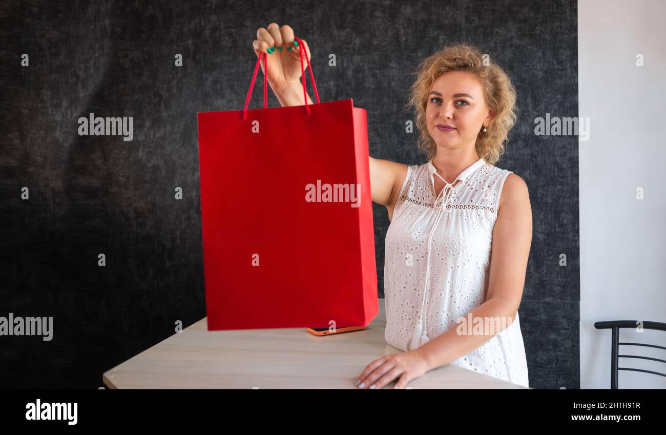 Woman buying new clothes cashier hi-res stock photography and images ...