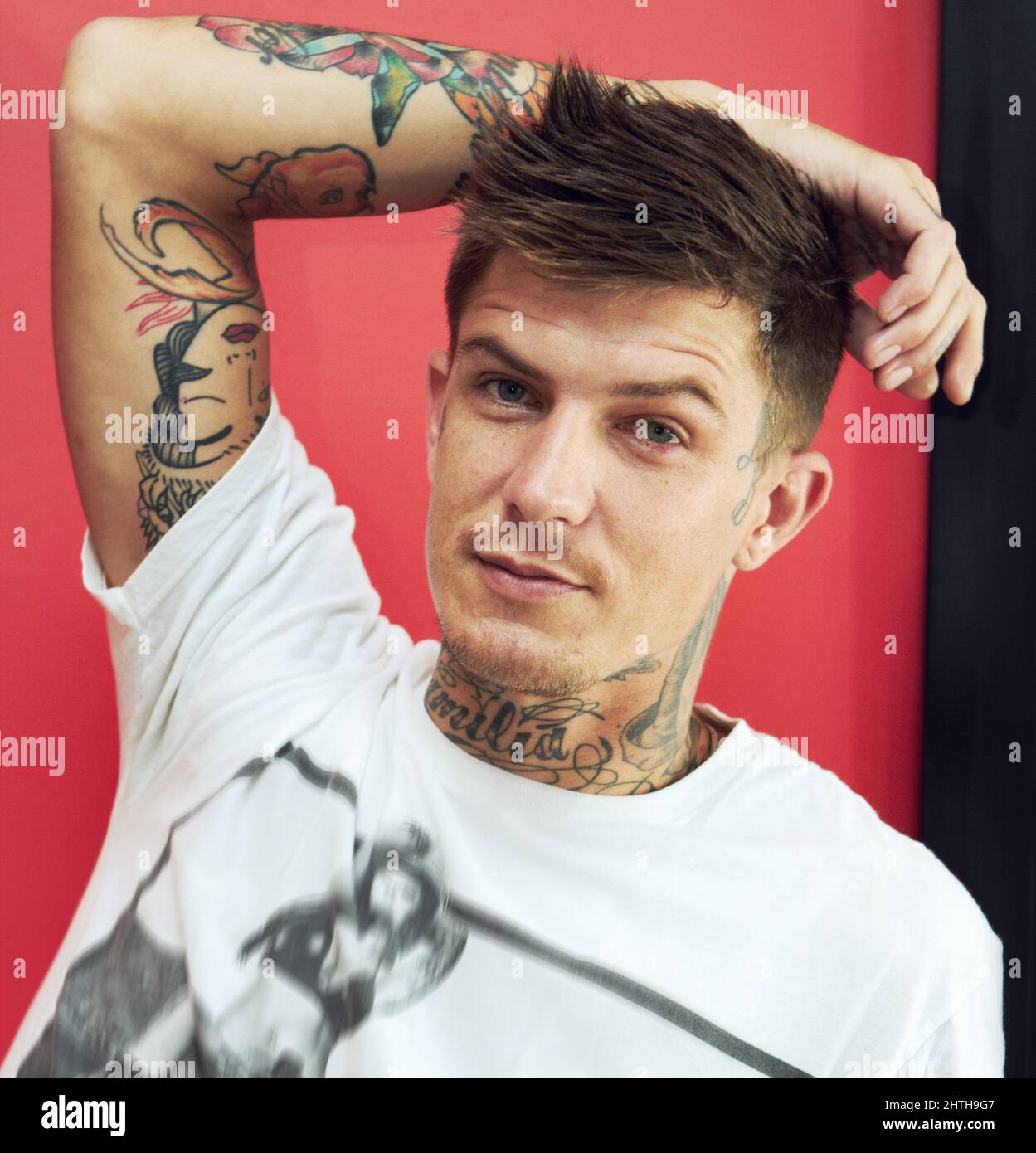 Proud to be an individual. Portrait of a handsome young man showing the tattoos on his arms. Stock Photo