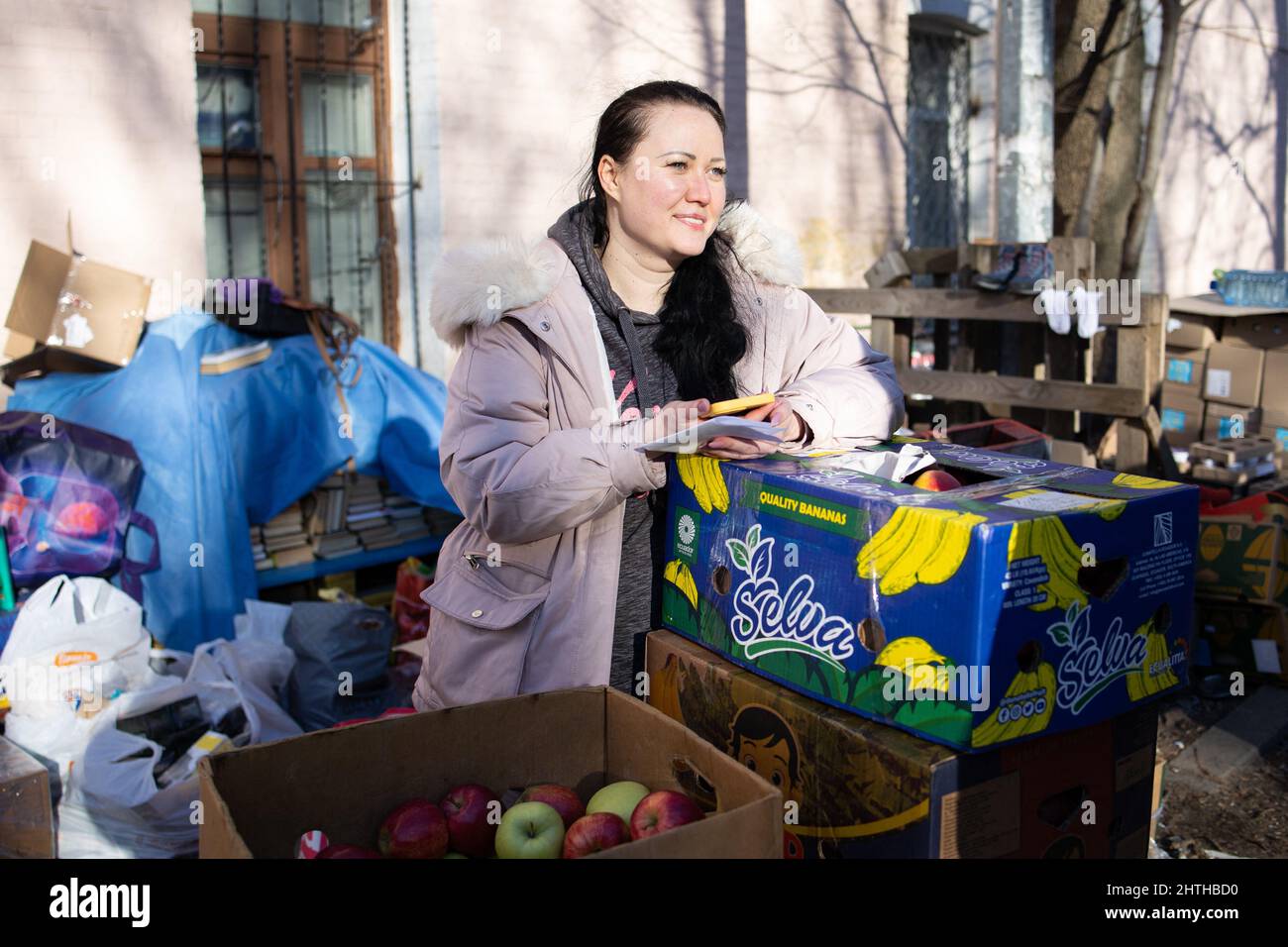 Civilian gather donations of supplies such as food for the volunteers
