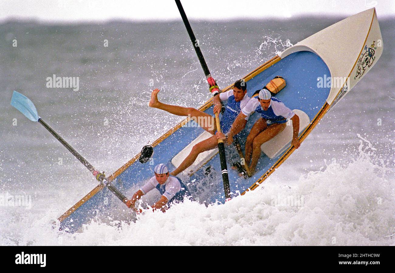 Surfboat crashing through a wave on the east coast of Australia Stock