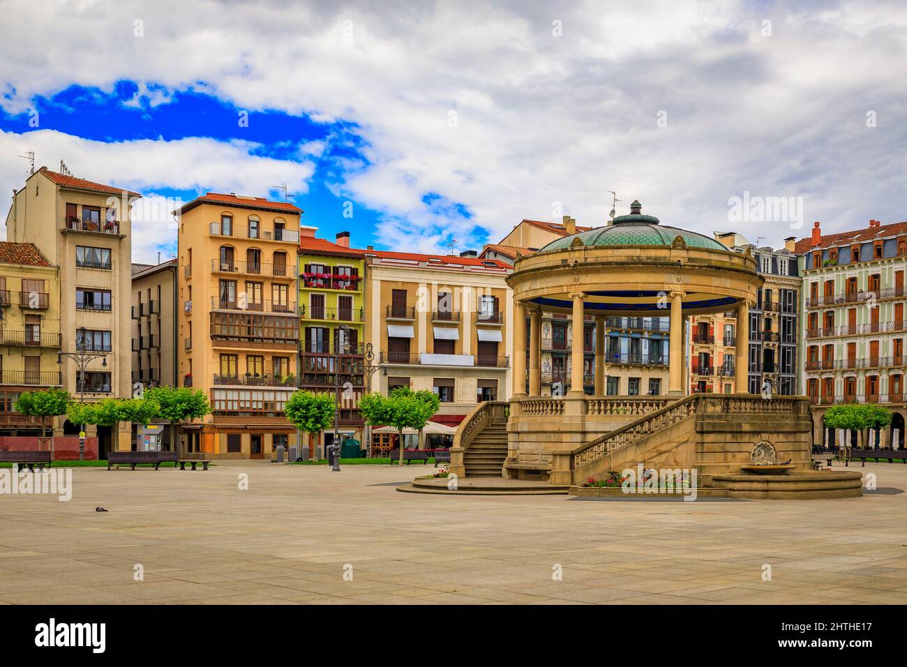 Historic Plaza del Castillo with restaurants and a central domed gazebo in Old Town, famous for running of the bulls in Pamplona, Spain Stock Photo