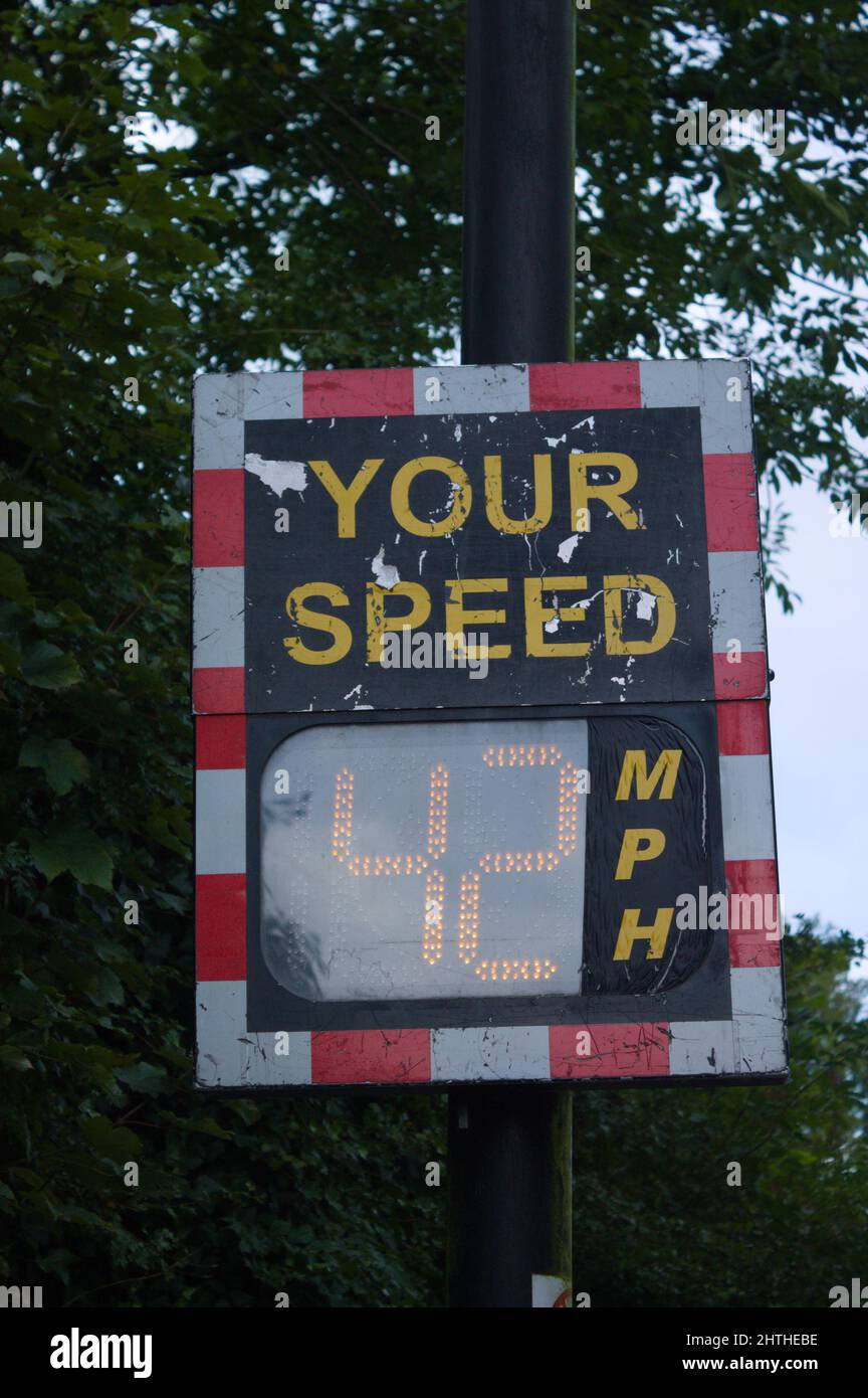 Digital speed limit sign, displaying 42 MPH. Driver can see in display his Speed and a Smiley under limit or a sad face by driving too fast Stock Photo
