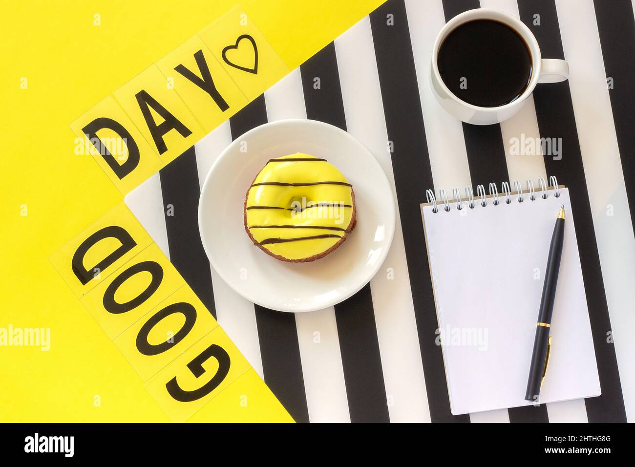 Text Good day, Coffee, and yellow rose on stylish black and white napkin on yellow background . Concept Flat lay Top view. Stock Photo