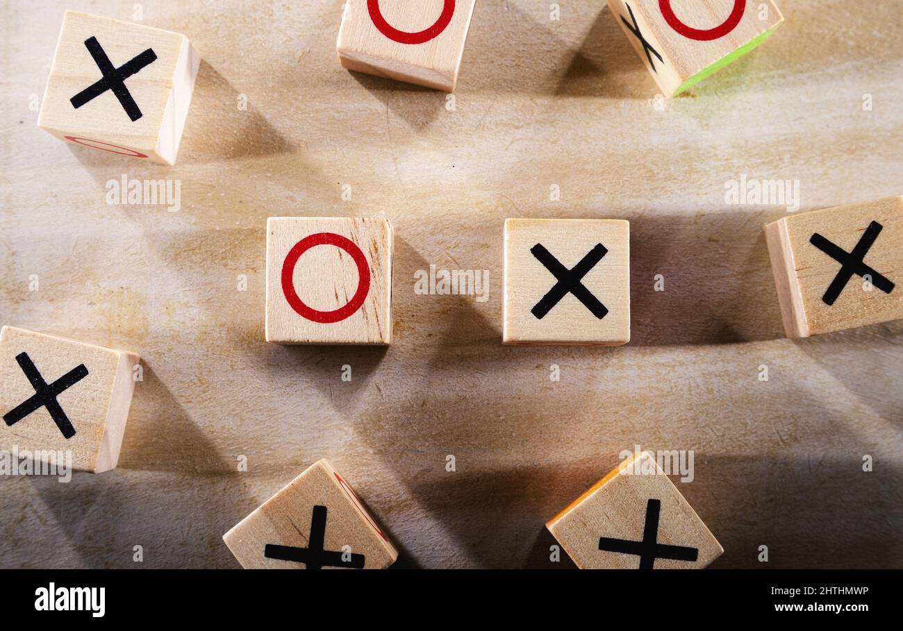 Pieces of XO game, abstract composition, multiple x pieces against o