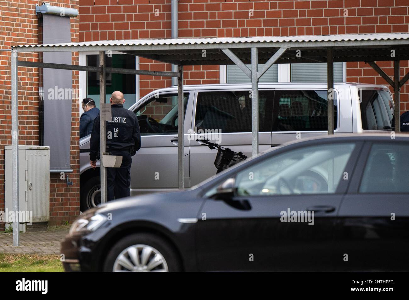 Oldenburg, Germany. 01st Mar, 2022. Niels Högel (l), a nurse convicted of murder, arrives at the Weser-Ems-Hallen before the start of the trial, where the Regional Court has moved the trial against former superiors of the former nurse at the Oldenburg and Delmenhorst hospitals due to lack of space. Högel, who was convicted of 85 murders in 2019, is expected to testify as a witness. Credit: Mohssen Assanimoghaddam/dpa/Alamy Live News Stock Photo