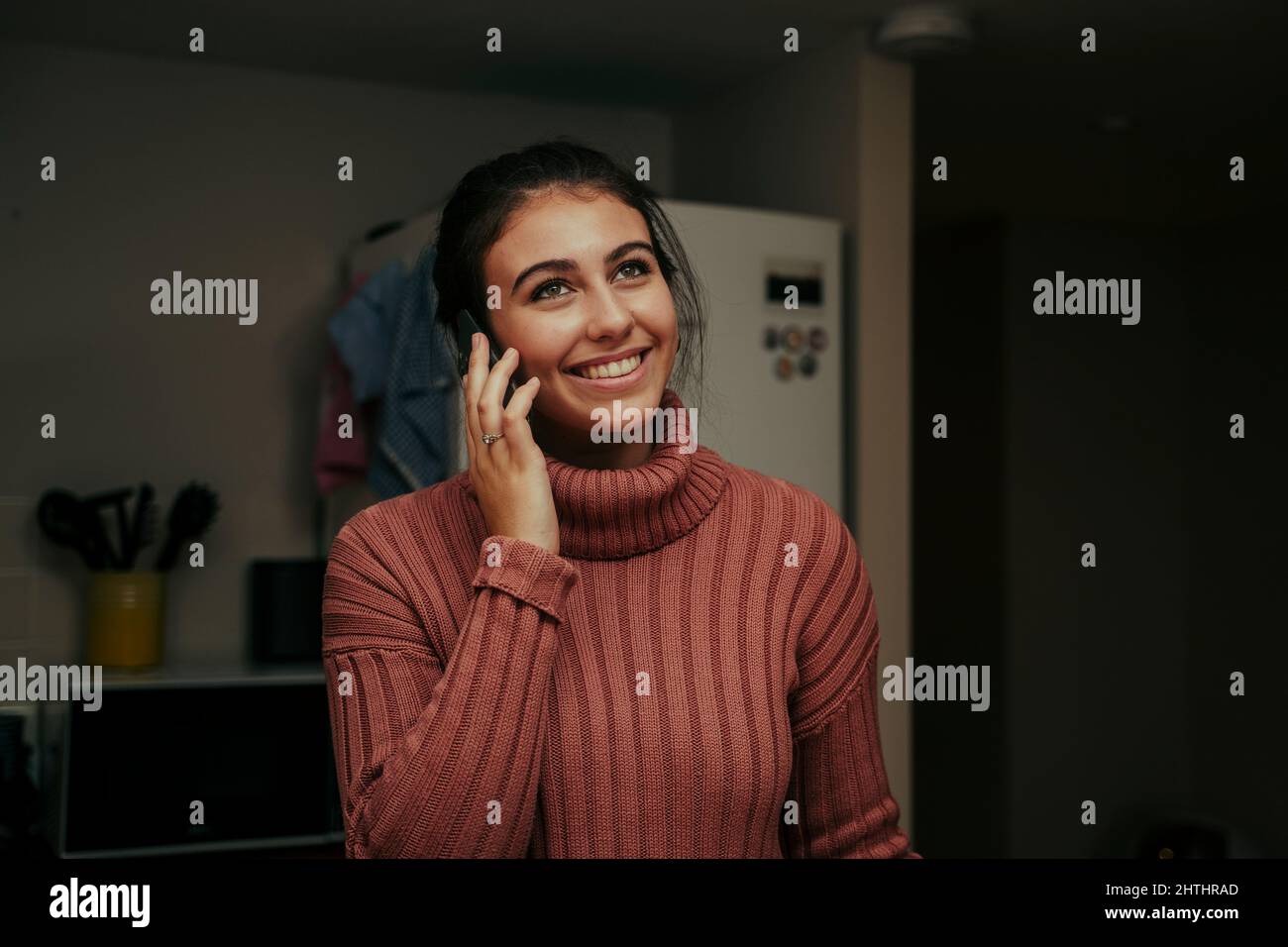 caucasian female talking on cellular device smiling Stock Photo