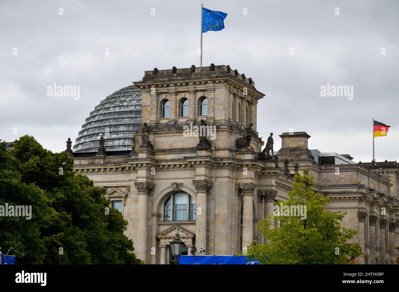 Berlin, Berlin, Germany - June 20 2014: View of the tower with the European flag of the Reichstag building in Berlin with the large Reichstag dome in Stock Photo