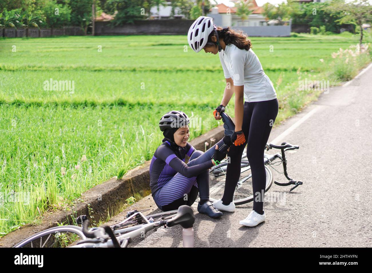 cyclist having a leg cramps while riding in the morning Stock Photo Alamy