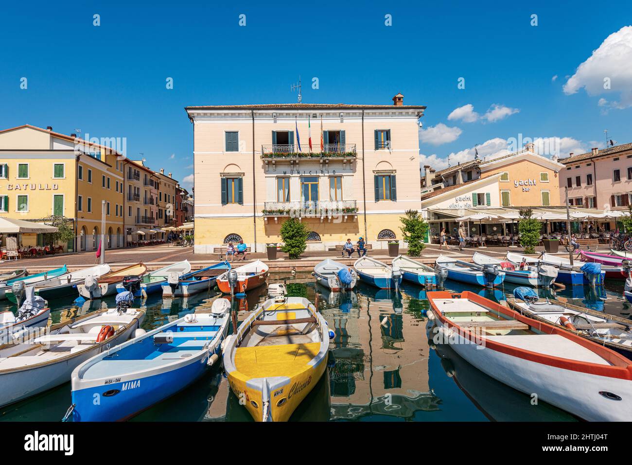 Small Port of the Lake Garda (Lago di Garda) with fishing boats moored. Bardolino village, tourist resort in Verona province, Veneto, Italy, Europe. Stock Photo