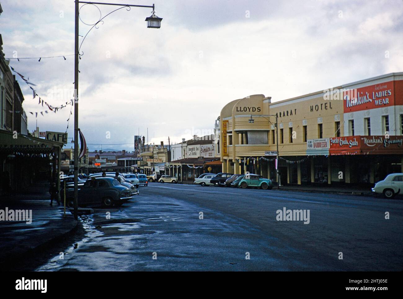Cars parked on wide street in city centre, Ararat Hotel, Barkly Street, Ararat, Victoria, Australia 1956 Stock Photo