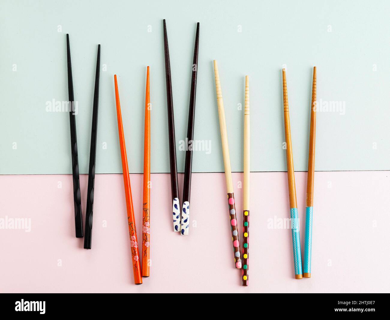 Various Pair Chopstick on Mint and Pink Background, Top View Stock Photo