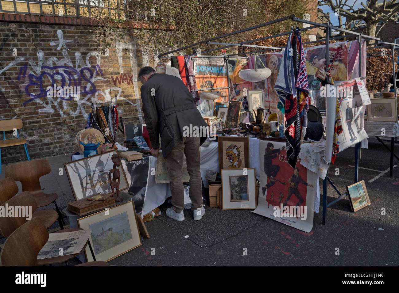 Visitors to street market, restaurants and cafes in Portobello Road