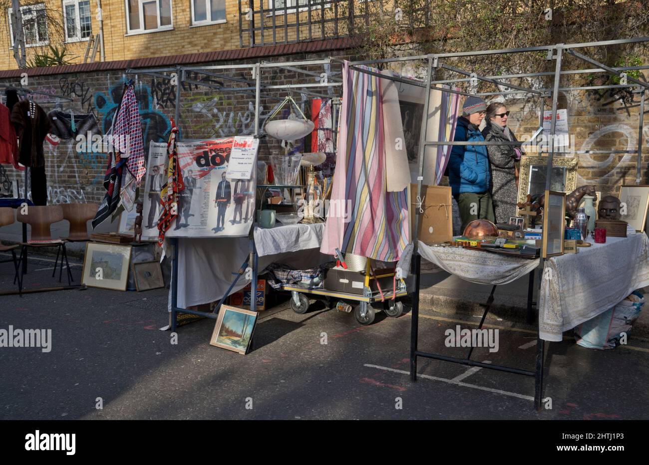 Visitors to street market, restaurants and cafes in Portobello Road