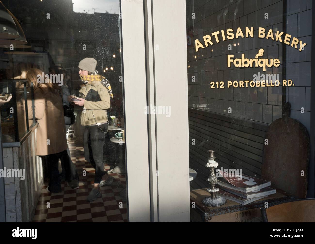 Visitors to street market, restaurants and cafes in Portobello Road