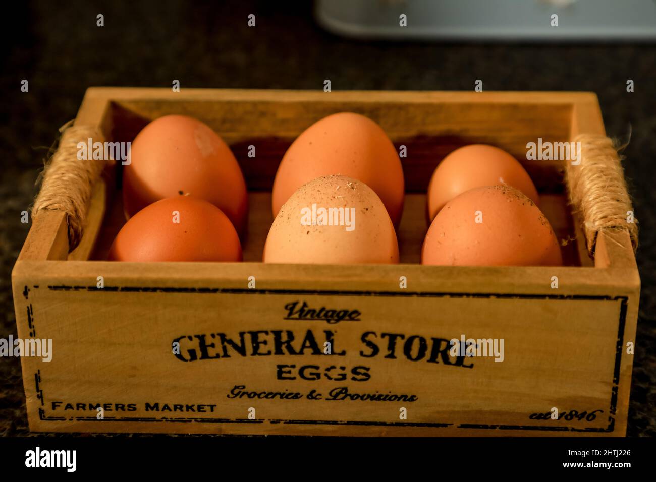 half a dozen freshly laid, eggs in an old fashioned presentation box