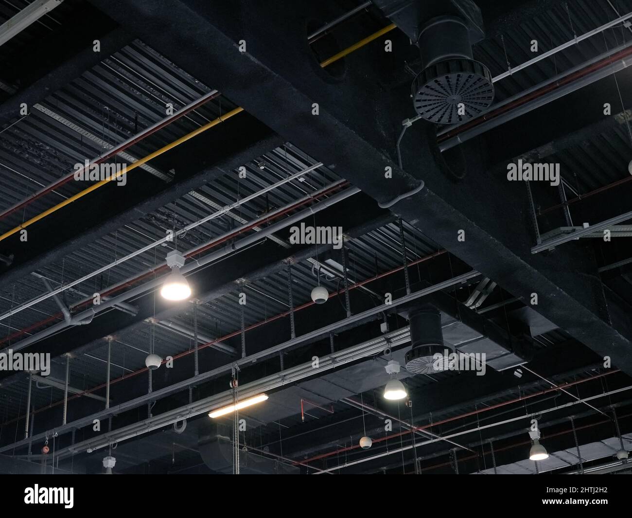 Ceiling of a trade fair with gas tubes and lights Stock Photo Alamy
