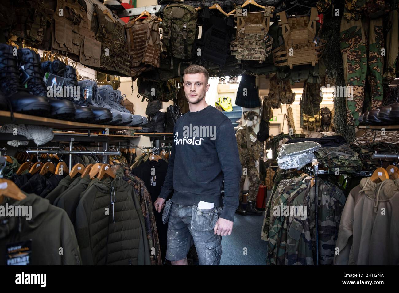 Picture shows a former British Paratrooper buying army surplus at G4