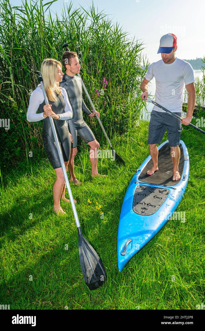 Introduction to the trend sport stand up paddling Stock Photo Alamy