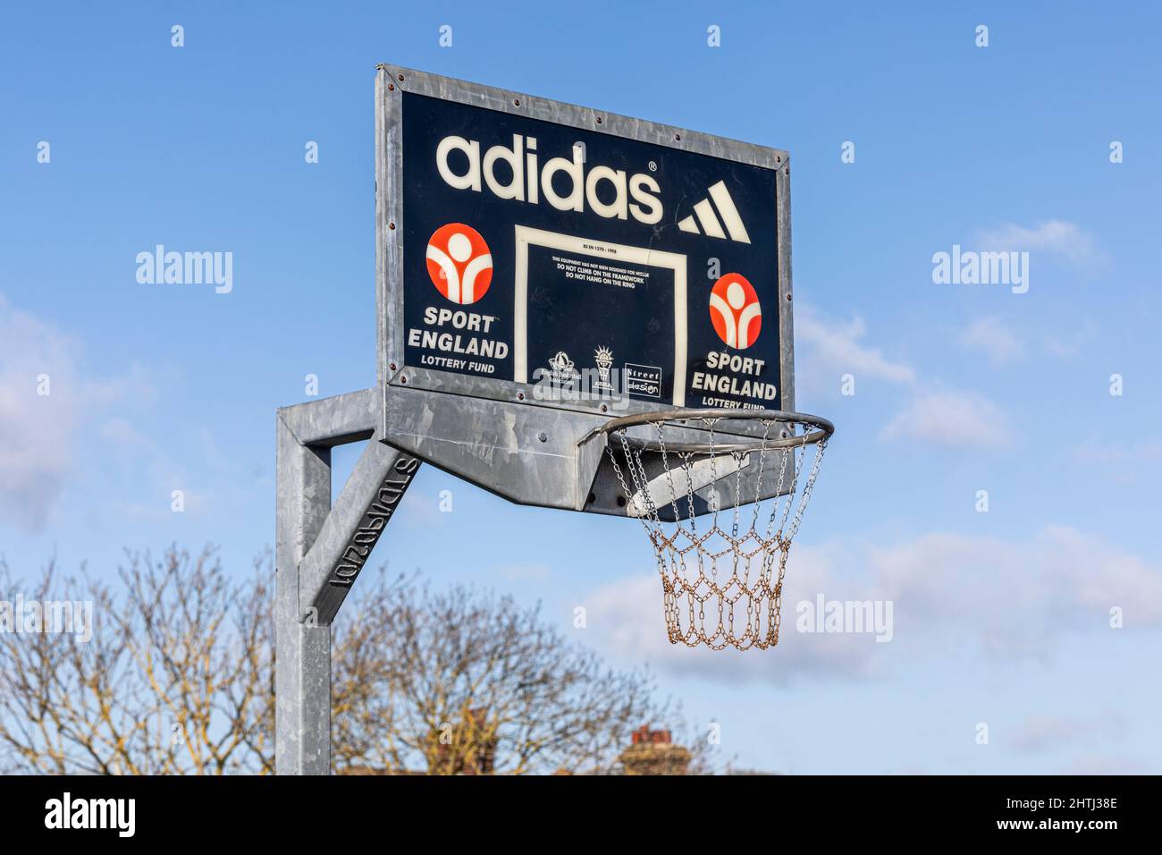 A metal Adidas, sport England basketball hoop Stock Photo